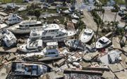Een dronefoto toont schade in de nasleep van orkaan Ian in Fort Myers, Florida. beeld EPA, Tannen Maury