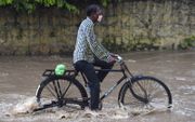 „In Azië kampt men met overstromingen en orkanen.” beeld AFP, Money Sharma