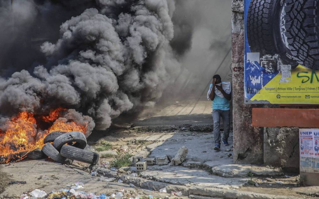 Het is al jarenlang onrustig in Haïti. Ontvoeringen en geweld zijn aan de orde van de dag. Daarom protesteren Haïtianen op straat tegen de onveiligheid in het land.  beeld AFP, Richard Pierrin

