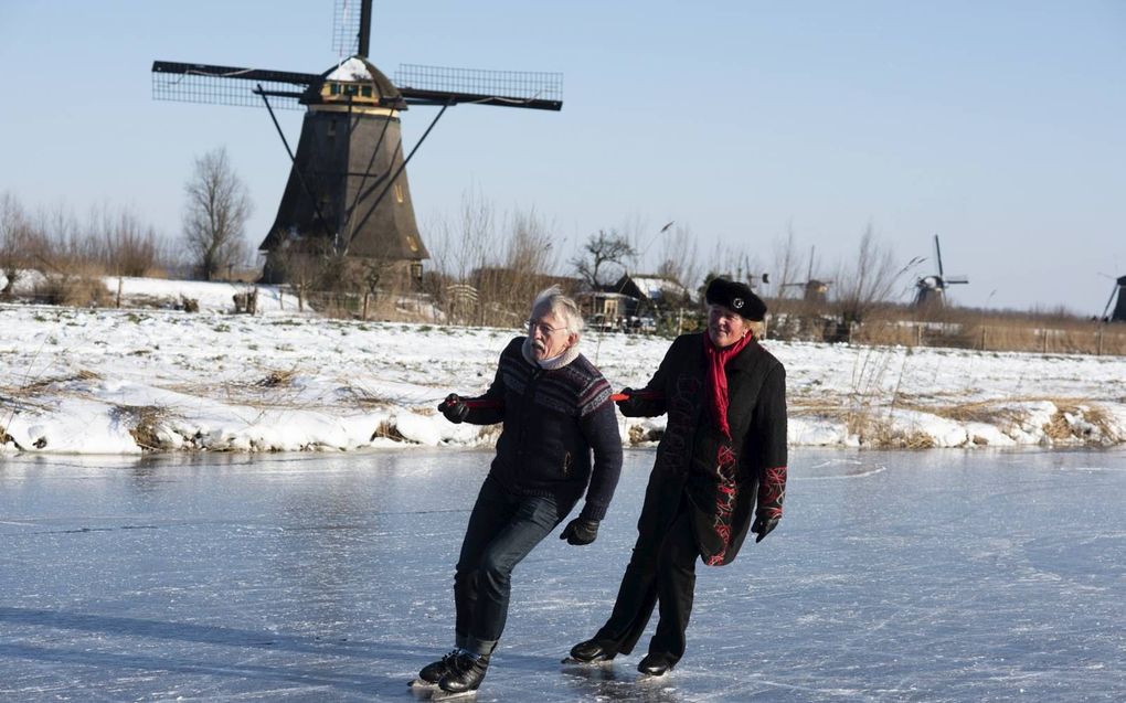 Pleunie Korteland met Johan Westerbeek aan het schoonrijden bij Kinderdijk. beeld Q. de Leeuw