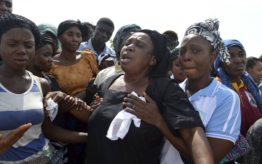 Christenen in Nigeria rouwen na een aanslag in 2018. beeld AFP, Emmy Ibu