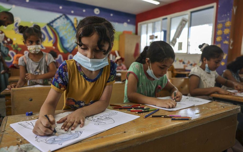 Palestijnse kinderen tijdens een zomerprogramma van UNRWA. beeld AFP, Said Khatib