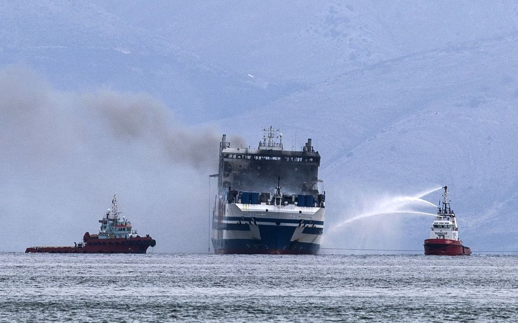 Bluswerkzaamheden bij de Olympia. beeld AFP, Angelos Tzortzinis