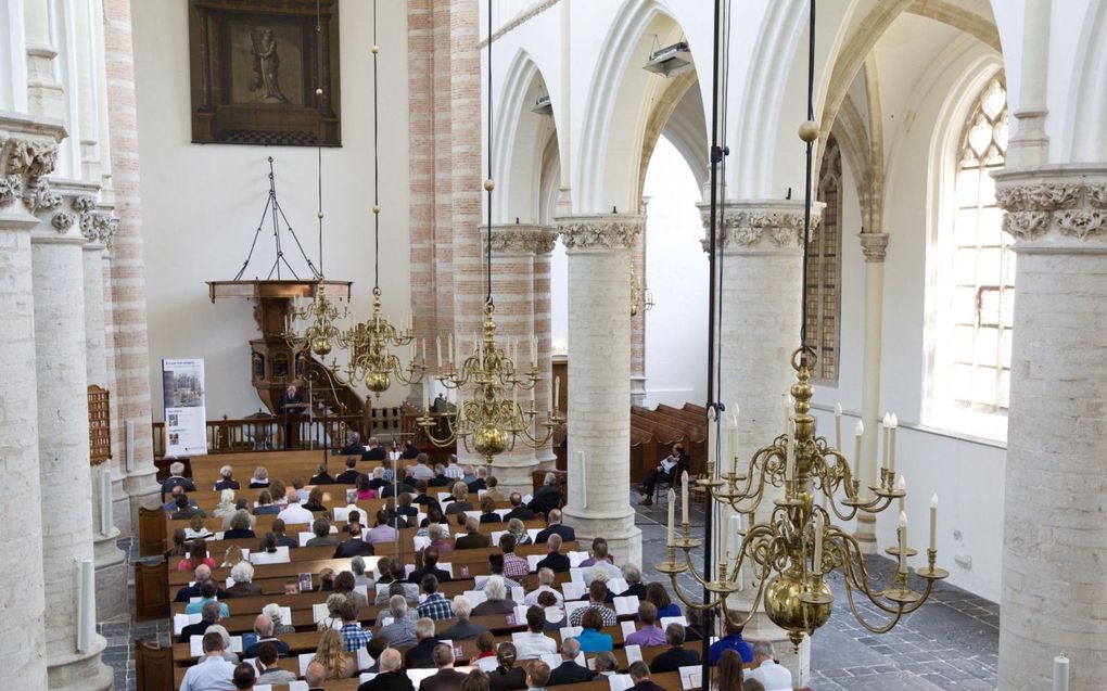 „Zelfs als we alleen door middel van psalmen tot aanbidding willen komen, is een creatievere praktijk mogelijk.” Archieffoto: symposium over onbekende psalmen in Tholen in 2013. beeld RD, Anton Dommerholt