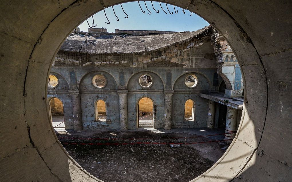 Een door IS verwoeste Syrisch-katholieke kerk in Mosul. Christenen in het Midden-Oosten lopen het gevaar om „uitgeroeid” te worden, was de conclusie van een Brits rapport uit 2019. beeld AFP, Zaid Al-Obeidi