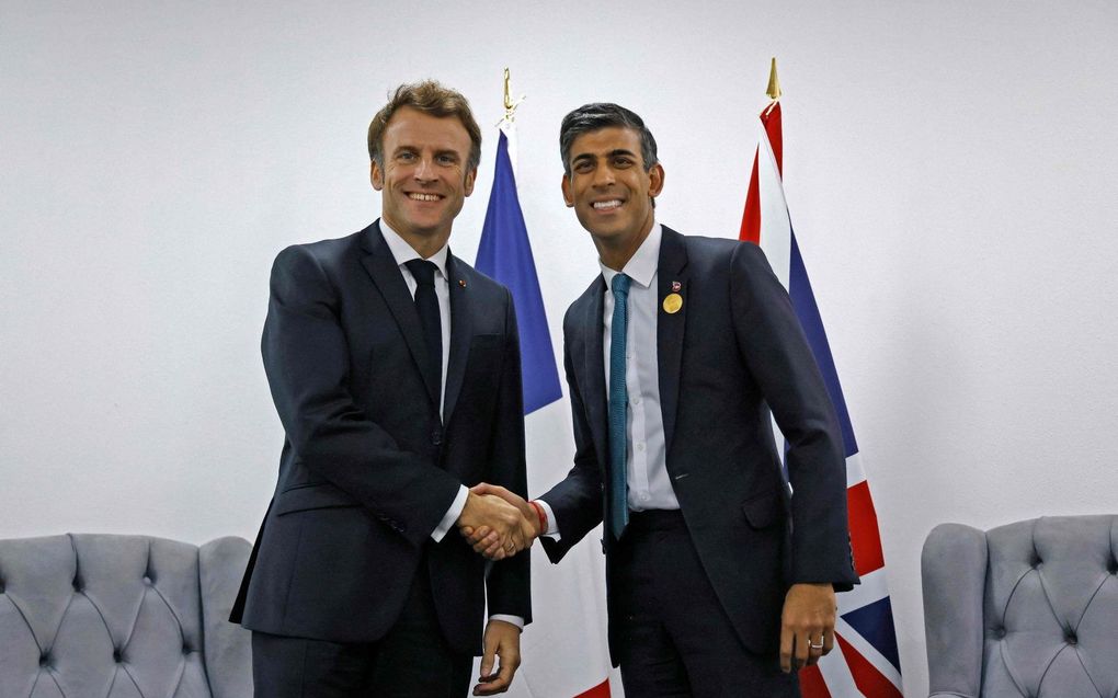 De Britse premier Rishi Sunak (R) en de Franse president Emmanuel Macron. beeld AFP, Ludovic Marin