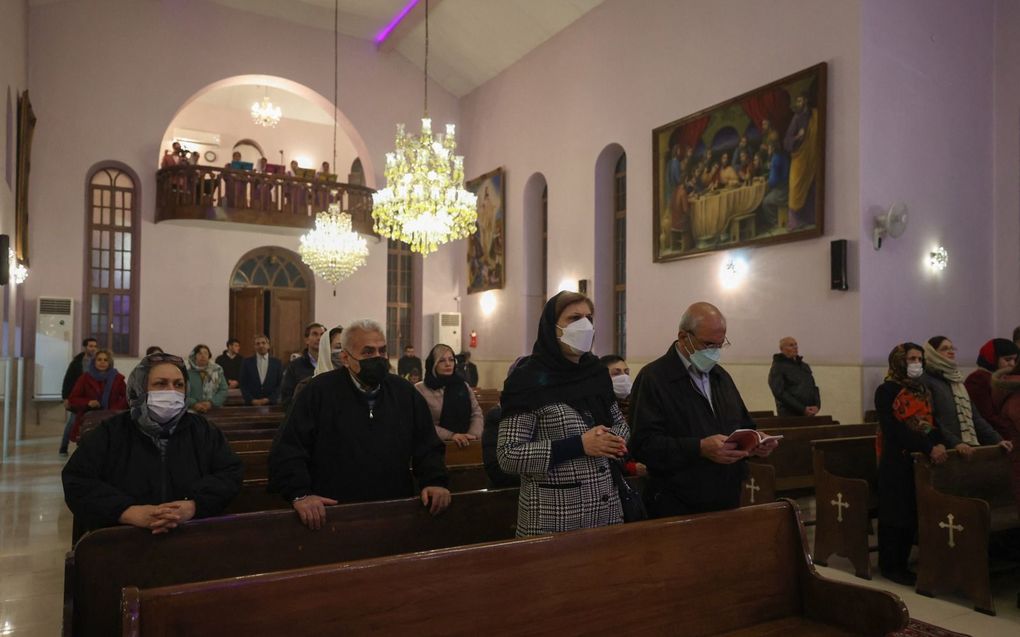 Een nieuwjaarsdienst in de door de Iraanse overheid erkende Armeense Sint Targmanchatskerk in Teheran. beeld AFP, Atta Kenare