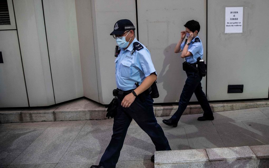 Chinese politieagenten (niet in Taiyuan). beeld AFP, Isaac Lawrence