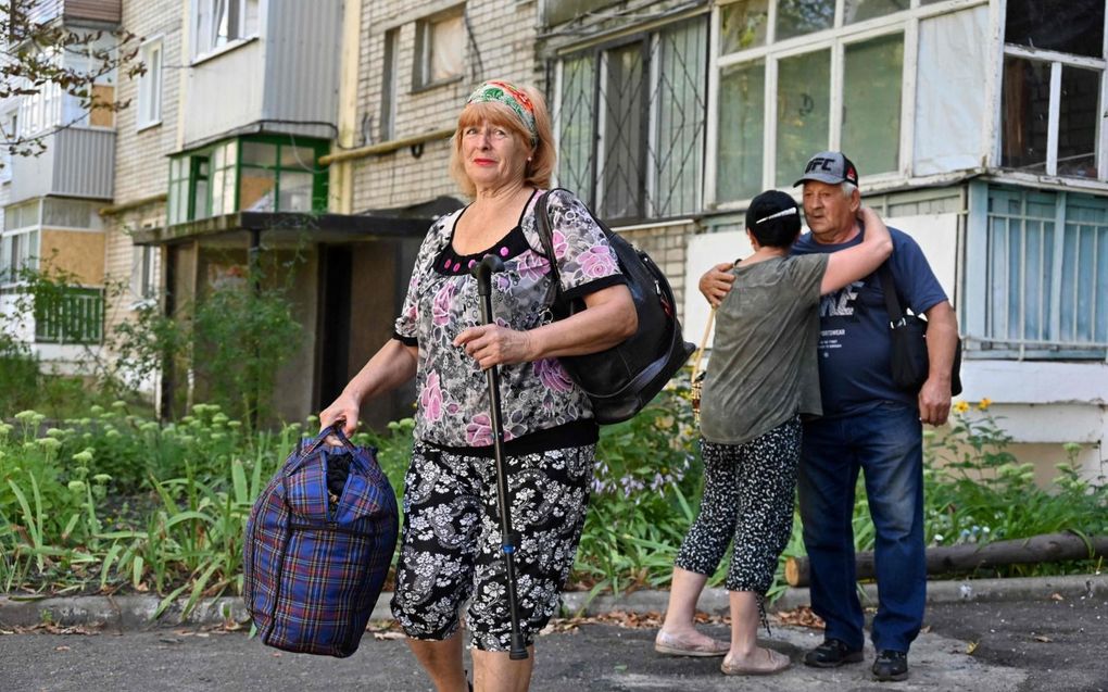 Oekraïners in Charkiv worden geëvacueerd. beeld AFP, Sergey Bobok
