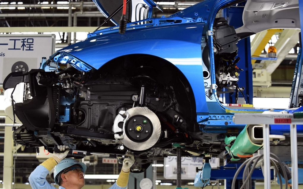 Assemblage van auto’s in een fabriek in de Japanse prefectuur Aichi. Dinsdag kwamen twaalf fabrieken stil te liggen. beeld AFP, Toshifumi Kitamura