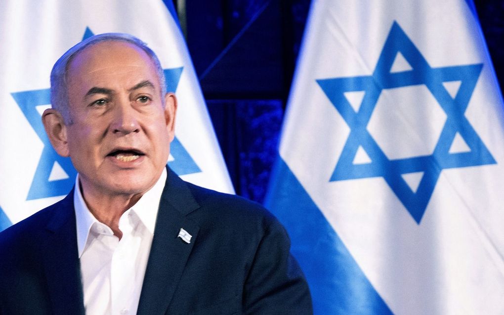 „De Israëlische premier Netanyahu garandeerde in een strijdbare toespraak een nieuwe Joodse overwinning. Daarbij werd echter niet de reddende Hand van Jahweh geroemd maar de strijdvaardigheid van het Joodse volk.” beeld AFP, Brendan Smialowski