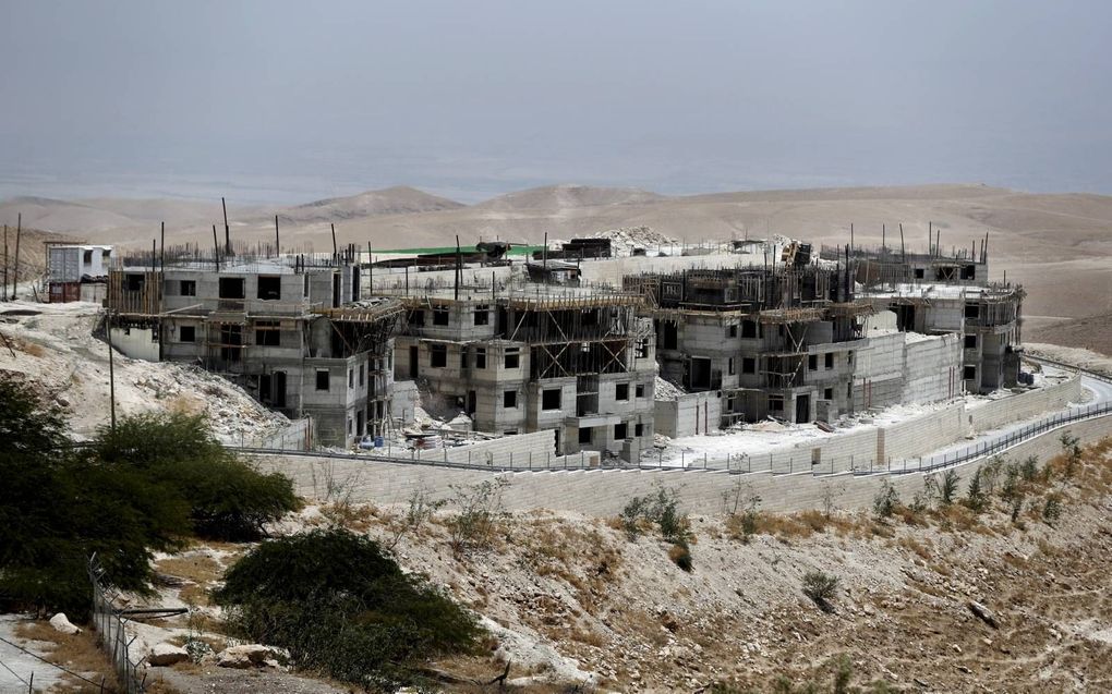 Israël laat nederzettingen door het leger bewaken, keurt regelmatig nieuwe of uitbreiding van bestaande goed en verstrekt actief subsidie op wonen in nederzettingen om ze aantrekkelijk te maken. beeld AFP, Thomas Coex