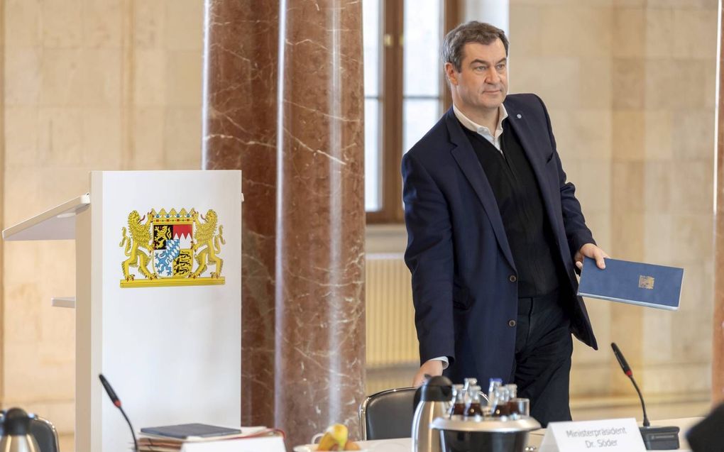 De Beierse minister-president Markus Söder heeft christenen sinds de corona-uitbraak meermalen opgeroepen tot gebed. beeld AFP, Peter Kneffel