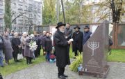 Gebed ter nagedachtenis voor de vermoorde Joden van Krimenchuk in 2018, door opperrabbijn Jacobs. beeld Christenen voor Israël