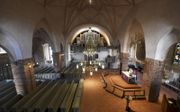 Dienst op Witte Donderdag tijdens de coronalockdown in 2020 in de evangelisch-lutherse kathedraal van Espoo. De domkerk stamt uit de Middeleeuwen. beeld AFP, Vesa Moilanen