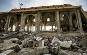 „Christenen zouden per definitie verdrukt moeten worden, in het groot maar zeker ook in het klein.” Foto: verwoeste kerk in Syrië. beeld AFP, Delil Souleiman