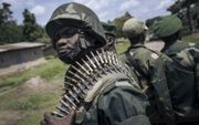 Congolese militairen op patrouille in de strijd tegen de gewelddadige islamistische groepering ADF. beeld AFP, Alexis Huguet