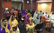 Migranten uit India tijdens een kerkdienst in Koeweit. beeld NBG