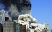 Brandend WTC na de aanslagen. beeld AFP, Hennny Ray Abrams