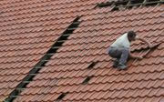 Nietsvermoedend een paar dakpannen aan het herschikken. beeld ANP, VidiPhoto