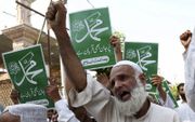 Pakistaanse moslims eisten in 2018 de doodstraf voor de inmiddels van blasfemie vrijgesproken Asia Bibi. beeld EPA, Shahzaib Akber