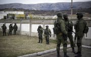 In 2014 verschenen er op de Krim plotseling onherkenbare in het groen geklede militairen. Later bleken dat Russische soldaten te zijn. beeld EPA, Alexey Furman