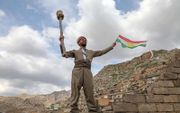 Een Koerd viert Perzisch Nieuwjaar. beeld AFP, Safin Hamed