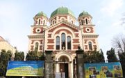 De Sint-Joriskerk in het West-Oekraïnse Lviv maakt geen geheim van de sympathie voor Oekraïne. beeld Floris Akkerman​