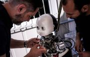 Een robot in de maak. beeld AFP, Marco Bertorello
