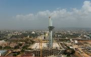 Skyline van Abuja of Aboedja, de hoofdstad van Nigeria in westelijk Afrika. beeld RD, Henk Visscher