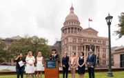 De eisers maakten dinsdag voor het State Capitol in de Texaanse stad Austin hun aanklacht wereldkundig. beeld AFP, Suzanne Cordeiro