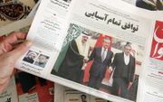 Een Iraanse krant meldt de overeenkomst tussen Iran en Saudi-Arabië om de betrekkingen de normaliseren. beeld AFP, Atta Kenare