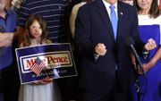 Een jonge supporter van Mike Pence, woensdag bij de aftrap van diens campagne in Ankeny, Iowa. beeld AFP, Scott Olson