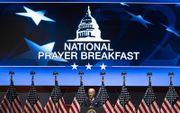 Religie is zichtbaar in de publieke ruimte in de VS, maar ook daar gaat secularisatie door. Foto: president Biden tijdens het Nationale Gebedsontbijt 2022 in het Capitool. beeld EPA