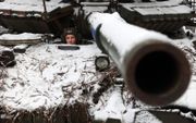 Een Oekraïense militair neemt met zijn tank deel aan de zware gevechten aan het front in Oost-Oekraïne. beeld AFP, Anatolii Stepanov