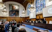 De rechters onder leiding van president Donoghue in het Internationaal Gerechtshof voorafgaand aan de uitspraak. beeld ANP REMKO DE WAAL