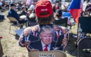 Een Trump-aanhanger deze week tijdens een bijeenkomst over immigratie. beeld AFP, SERGIO FLORES