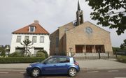 Het Kerkelijk Bureau van de Gereformeerde Gemeenten in Nederland, met het kerkgebouw in Opheusden. beeld Vidiphoto