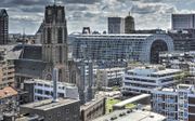 In onze maatschappij is God afgeschaft en ervaren christenen geloven als een optie. Foto: Rotterdam, met op de voorgrond de Laurenskerk. beeld iStock