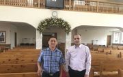 Pavel Shestakov (links) en Andrej Radchenko zijn twee voorgangers in de geregistreerde baptistengemeente in Chabarovsk.  beeld RD