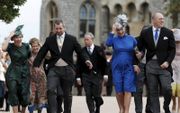 Autumn en Peter met Zara en haar man Mike Tindall tijdens het huwelijk van prinses Eugenie in 2018. beeld AFP, Alastair Grant