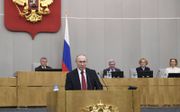 De Russische president Vladimir Poetin hield dinsdag een toespraak voor de Doema. beeld EPA, Yuri Kochetkov