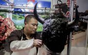 Chinezen zijn niet kieskeurig in wat ze eten. Foto: Markt in Peking. beeld AFP, Nicolas Asfouri