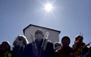 Gelovigen in Wit-Rusland dragen mondkapjes als zij een kerkdienst willen bijwonen. beeld AFP, Sergei Gapon