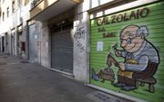 Gesloten winkels in Rome. De maffia proberen een voet tussen de deur te krijgen bij ondernemers. beeld EPA, Maurizio Brambatti