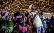 Vrouwen bezoeken een dienst in de Ecwa Church in de Nigeriaanse stad Kajuru. De meeste christenen wonen in Afrika.  beeld AFP, Luis Tato