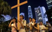 Christelijke demonstranten zijn op weg naar het huis van Carrie Lam, de leider van Hongkong, tijdens protesten tegen een Chinese uitleveringswet in 2019. beeld REUTERS, Danish Siddiqui