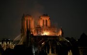 Het beeld van de metershoge vlammen die uit het dak van de Notre-Dame slaan, staat gegrift in het collectieve geheugen van de Fransen. beeld AFP, Bertrand Guay