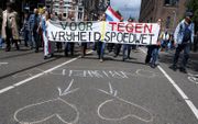 Deelnemers aan een Vrijheidsmars in Amsterdam protesteerden vorige week tegen de vrijheid beperkende maatregelen. beeld ANP, Evert Elzinga
