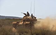 Turkse tank in actie op Cyprus. beeld AFP, Turkish Armed Forces